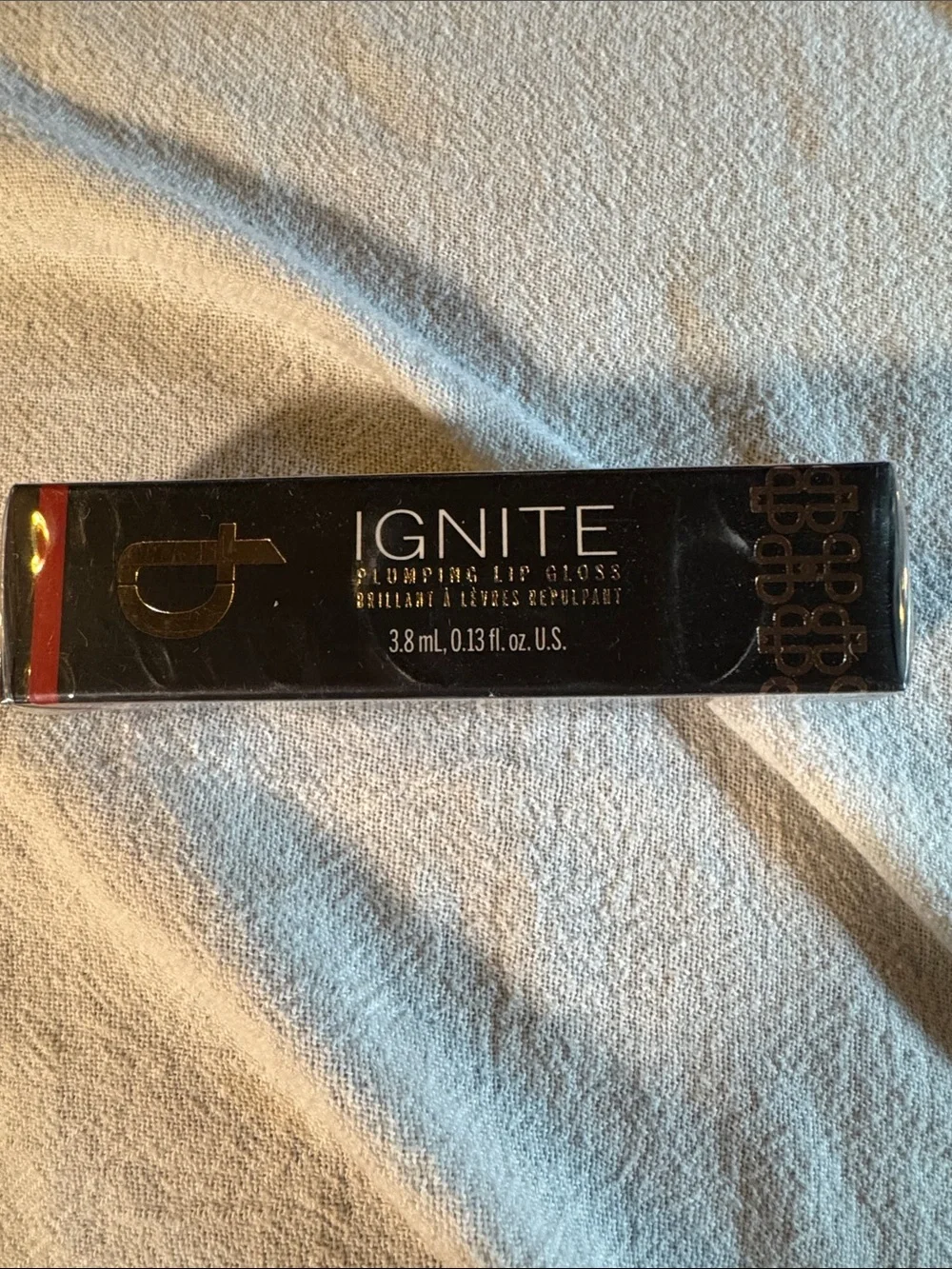 Ignite Lip Plumping Lip Gloss in Cinnamon - Deep Redish/ Gold Shade